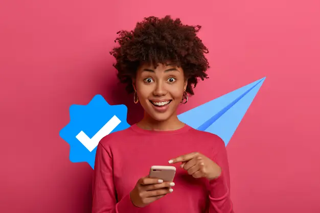 happy person pointing to mobile phone verifying accounts